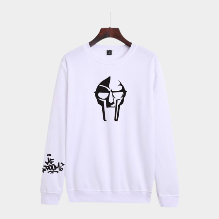Bold white MF DOOM sweatshirt printed villain mask showcasing striking graphics with metal face streetwear design